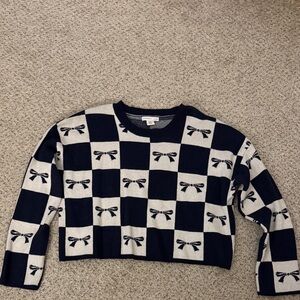 Checkered Navy and White Sweater with Bow Design